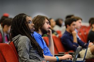 Close-up of audience members at HopHacks.