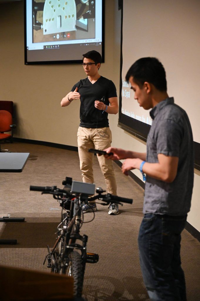 Travis Chan and Thomas Keady demonstrate YOLObike.