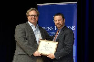 Michael Schatz receives the Johns Hopkins Alumni Association Excellence in Teaching Award from Dean Ed Schlesinger.