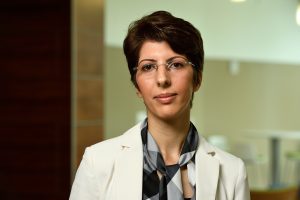 A headshot of Soudeh Ghorbani wearing a white blazer.