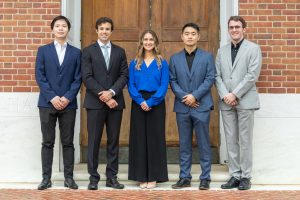 The 2025 class of Siebel Scholars pose in front of a brick wall. They are (from left) Jieneng Chen, Denis Routkevitch, Anastasia Georgiou, Fangchi Shao, and Benjamin Killeen.