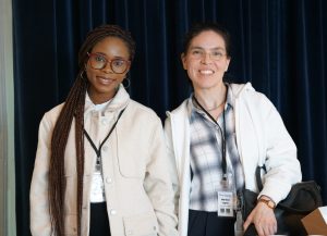 A student and Monica Lopez-Gonzales pose together.